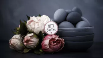 Dark toned Easter still life with peonies and hand painted ombre eggs
