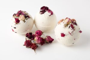 white bath balls with red