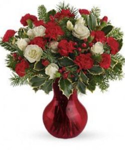 red and white flowers in red vase