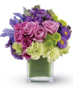 mod bouquet of lavender roses, blue iris and asters, accented with touches of chartreuse. 