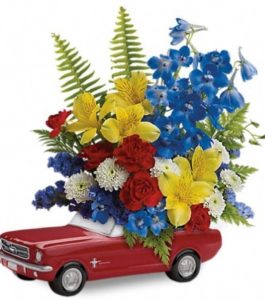 Vroom, vroom! Get his motor running this Father's Day with a freewheelin' gift he'll never forget - a bold bouquet of alstroemeria, carnations and mums, hand-delivered in a '65 Ford Mustang convertible keepsake. Hand-painted in classic poppy red, this ceramic collectible is one-of-a-kind, just like Dad.