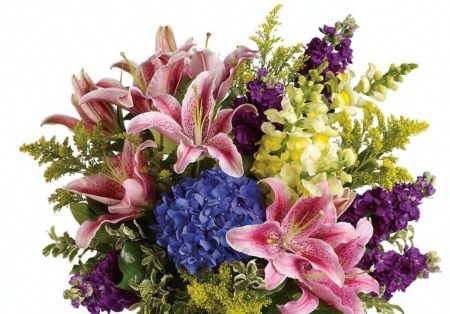 Bursting with two feet of fresh pink lilies, hydrangea, snap dragons and stock that are sure to brighten anyone's day. The bouquet is approximately 20" W x 25 1/2" H
