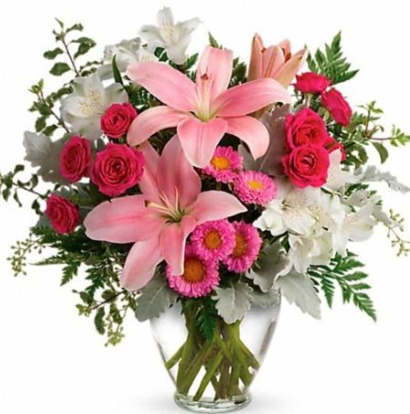 This pretty bouquet features hot pink spray roses, pink asiatic lilies, white alstroemeria, pink matsumoto asters, seeded eucalyptus, leatherleaf fern, dusty miller, and pitta negra. Delivered in a Serenity Vase. 