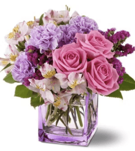 What’s the definition of a beautiful day? It’s a day where happiness reigns, everything seems right with the world and a glamorous bouquet of fresh flowers in delectable shades of raspberry, lavender and pink is received. A lavender vase adds an extra touch of charm, and will be treasured forever. Approximately 10" (W) x 10" (H)